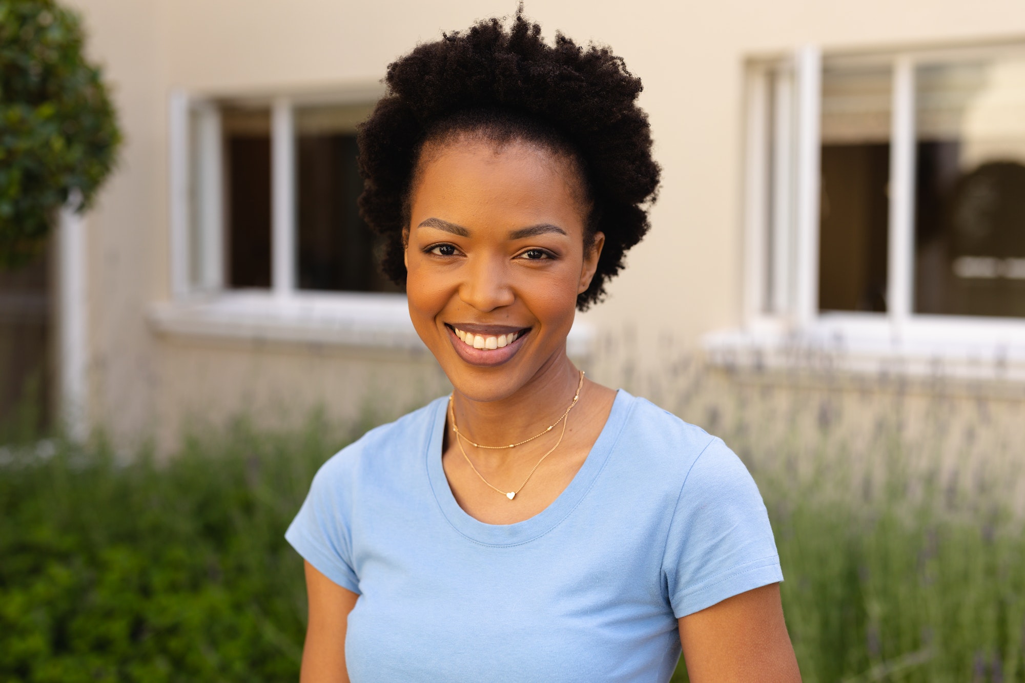 close-up-portrait-of-smiling-african-american-young-woman-smiling-while-standing-outdoors.jpg