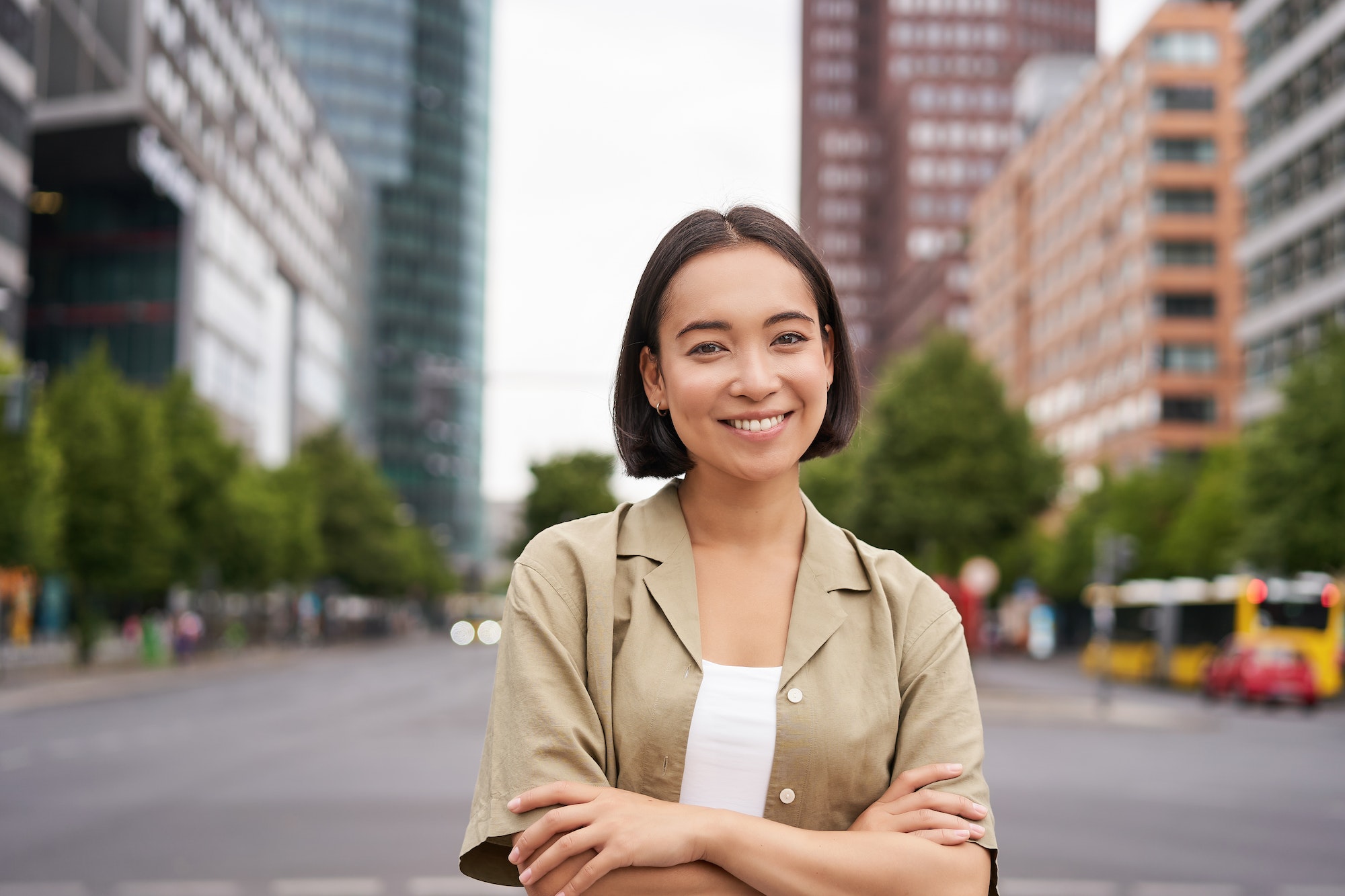 urban-people-young-happy-asian-girl-cross-arms-on-chest-posing-on-busy-city-street-smiling-with.jpg